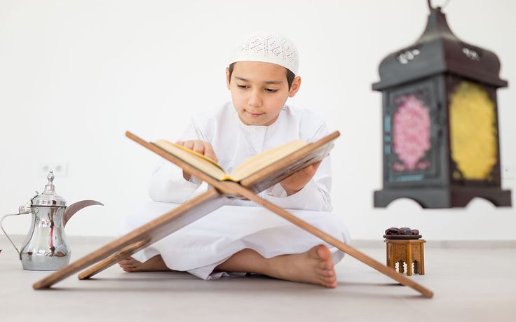 A family **learning the Quran online**.